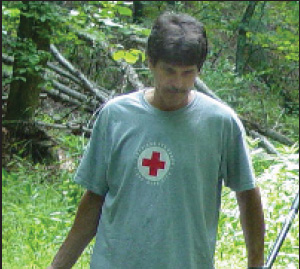 Man with red cross shirt