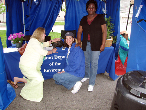 Photo of MDE’s Lead Program staff manning MDE tent at the Baltimore Flower Mart 