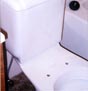 Eco-friendly flush toilet in rehabbed rowhouse