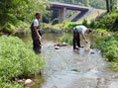 Two people collecting water quality samples  