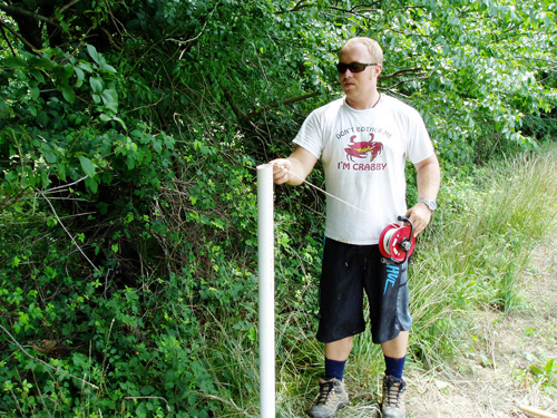 Photo of Kevin Coyne (MDE) taking groundwater measurements.