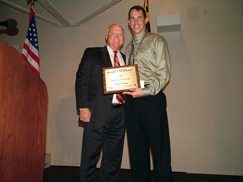 Photo of Michael Frank receiving EOY Award