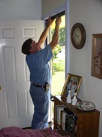 Photo of weatherstripping a door frame