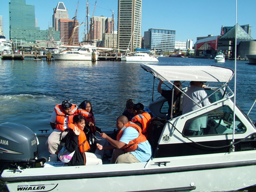 Students from Digital Harbor High School monitoring water quality at Baltimore Harbor