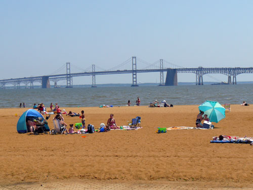 The beach at Sandy Point State Park in Anne Arundel County, with the Bay Bridge in the background.