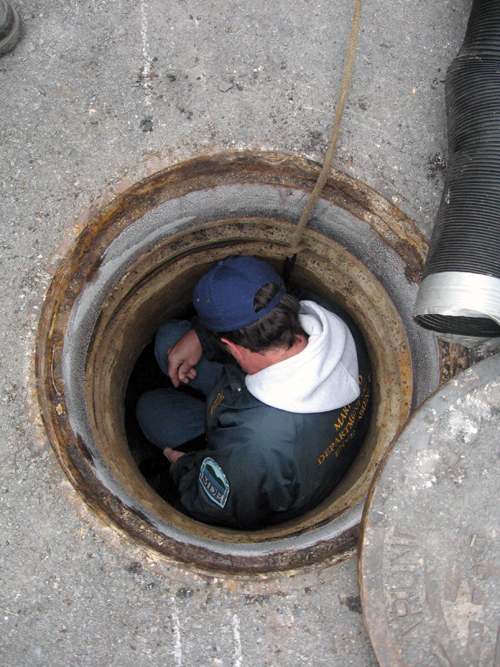 Bill Beatty inspecting end-of-line manhole adjacent to Furnace Creek