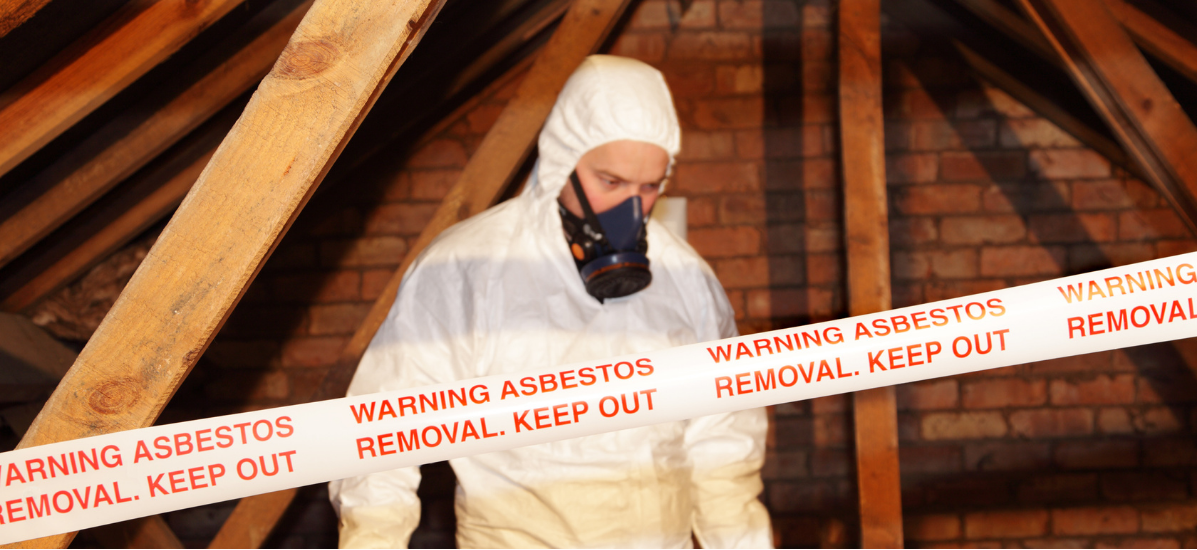 Contractor inspecting asbestos image