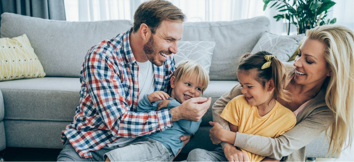 Homeowners with family inside home image