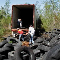 Youth loading scrap tires into truck