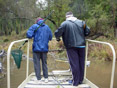Two people standing on a dock.