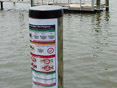 Fish advisory sign on a dock