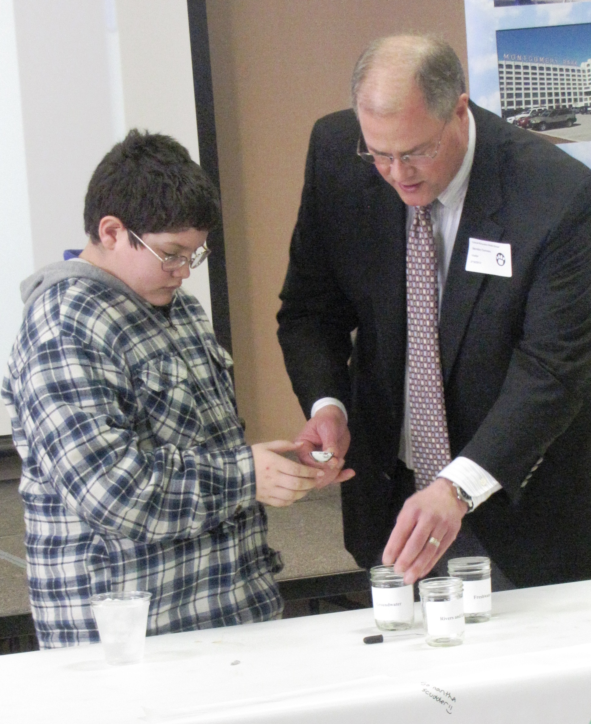 Secretary Summers conducts a groundwater demonstration with students at Col. Richardson Middle School